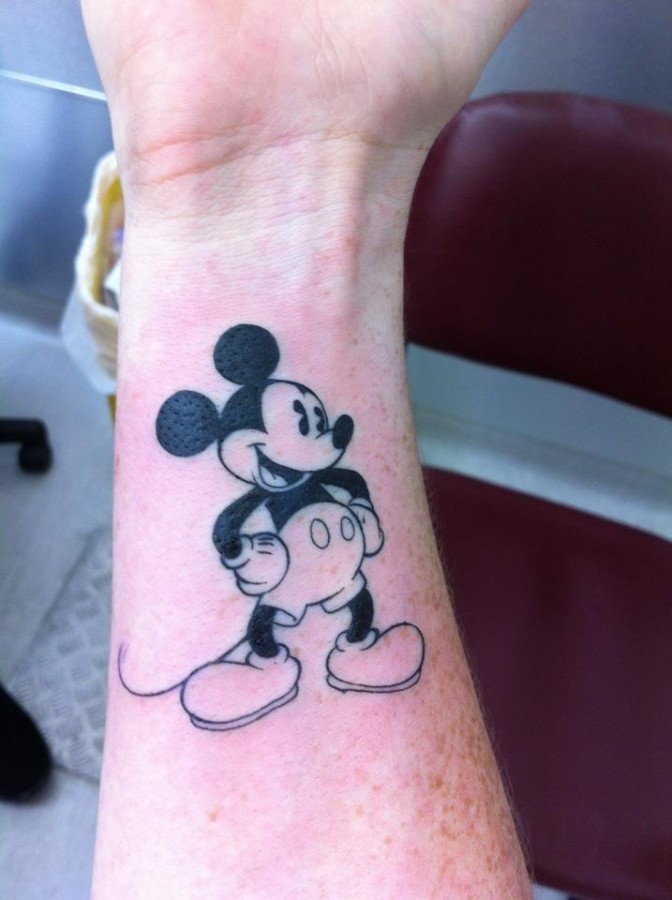 Cool hand’s Mickey Mouse tattoo on arm