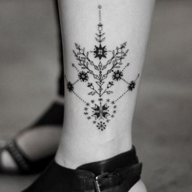 Cute flowers geometric tattoo on leg