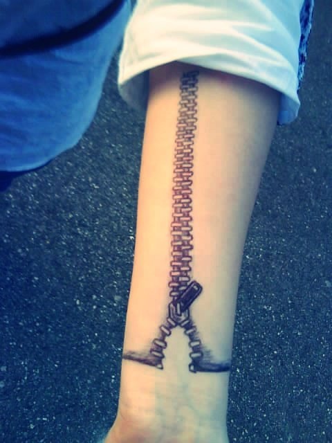 Cute women’s zip tattoo