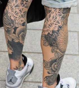 Different black forms geometric tattoo on leg