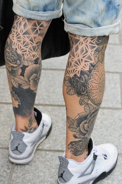 Different black forms geometric tattoo on leg