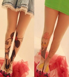 Funny duck and Mickey Mouse tattoo on leg