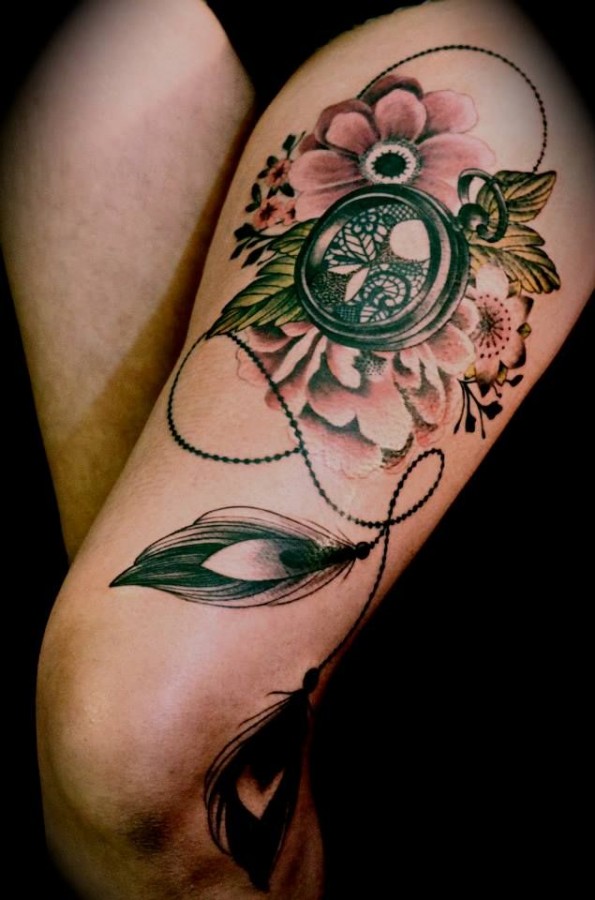 Gorgeous flowers compass tattoo on leg
