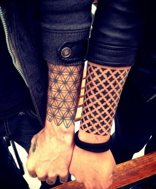 Great looking black two geometric arm tattoos