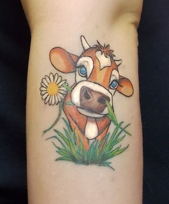 Green and yellow flower cow tattoo