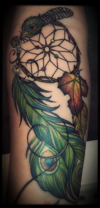 Green feather and yellow leaf peacock tattoo