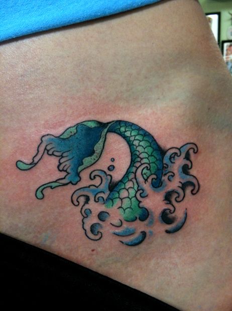 Green fish and mermaid tattoo