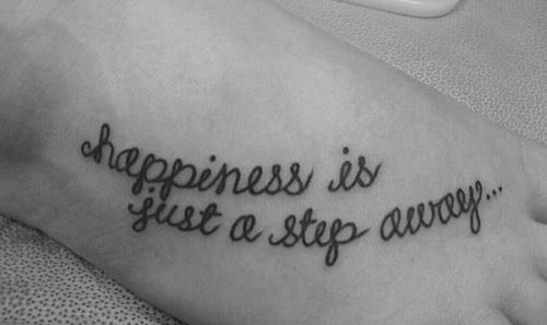 Happiness quote girl tattoo on foot