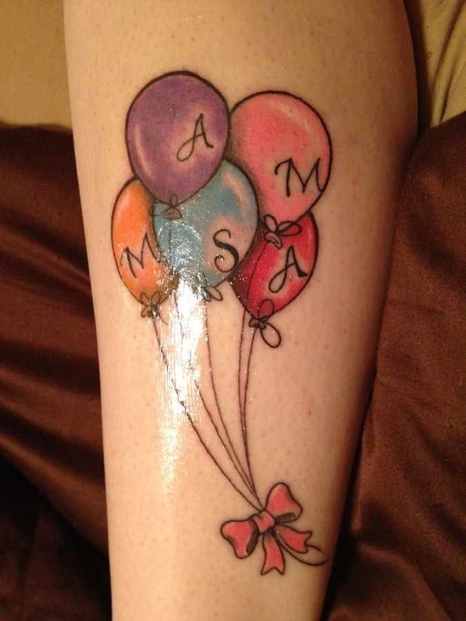 Letters and colorful balloon tattoo