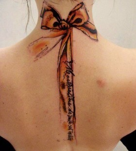 Lovely bow yellow tattoo