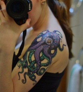 Nikon camera octopus tattoo on arm