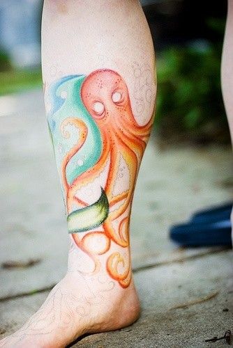 Orange, blue octopus tattoo on leg