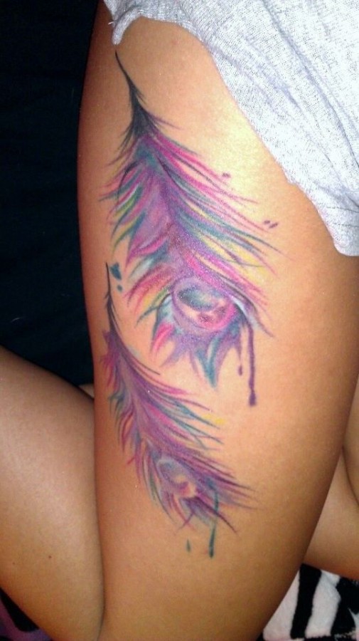 Pink colorful peacock tattoo on leg