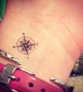 Pretty small wrist compass tattoo on arm