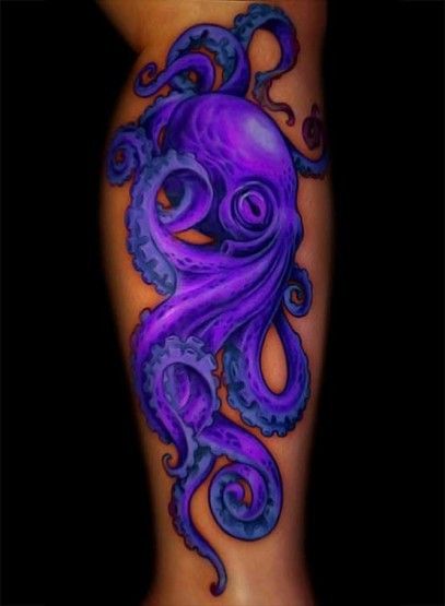 Purple black octopus tattoo on arm