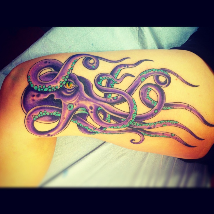 Purple eyes and octopus tattoo on leg