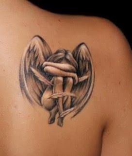 Realisti small girl’s angel tattoo on shoulder