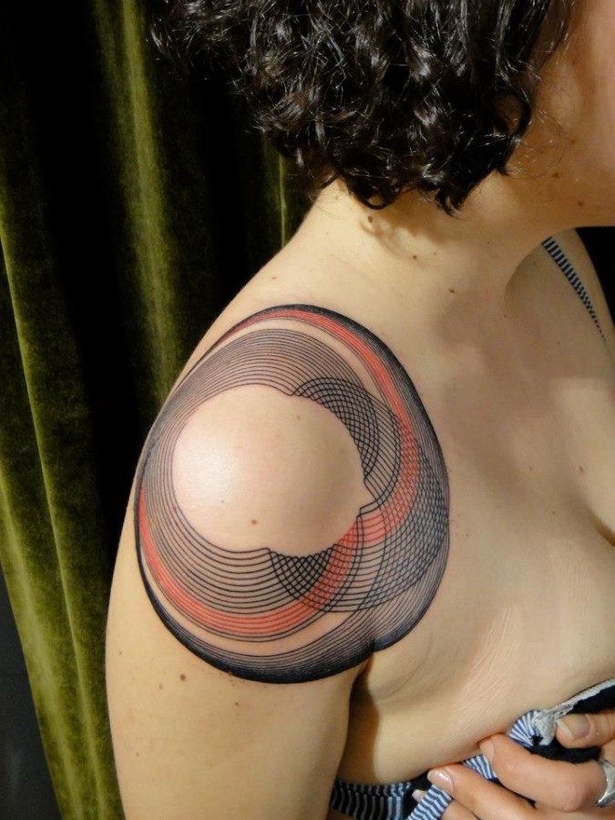 Red and black geometric shoulder, back tattoo