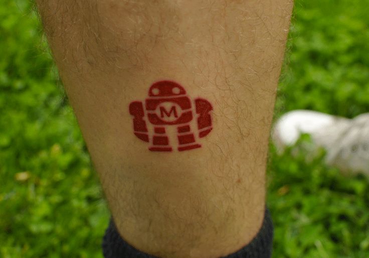 Small red robbot tattoo