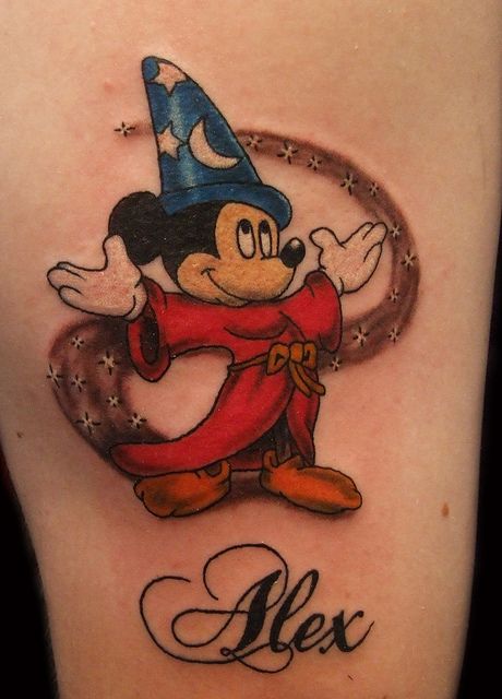 Stars, moons Mickey Mouse tattoo on arm