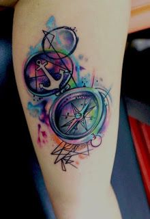Watercolor anchor and compass tattoo on arm