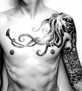 White shoulder and octopus tattoo on arm