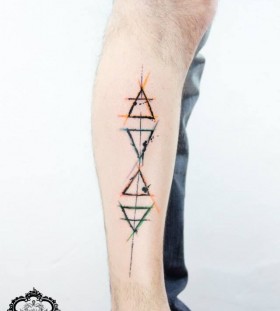 Yellow and green ornaments geometric tattoo on leg