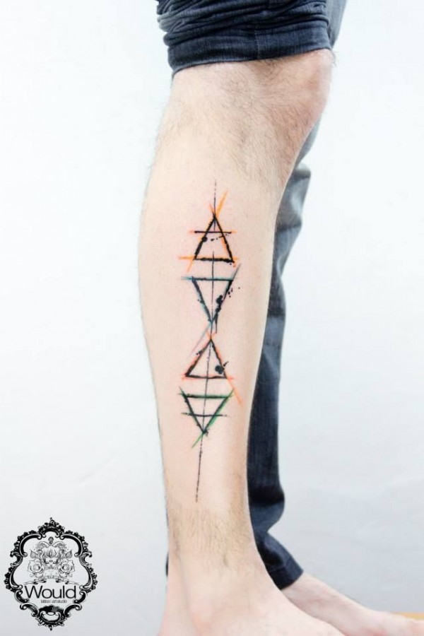 Yellow and green ornaments geometric tattoo on leg