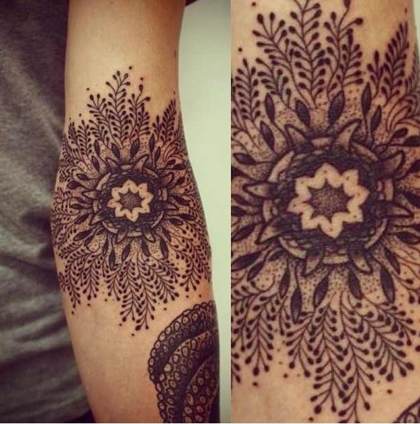 beautiful snowflake tattoo on arm