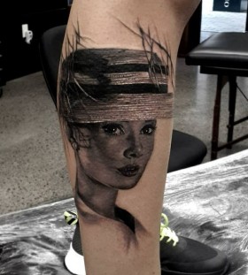black and white audrey tattoo on leg