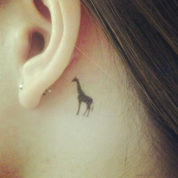 black giraffe tattoo near ear