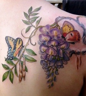 lilac with butterfly tattoo on the shoulder and back