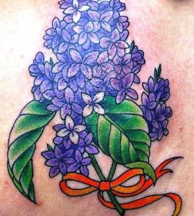 lilac with orange ribbon tattoo