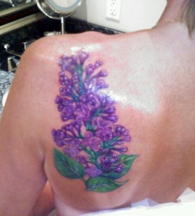 multicolored lilac tattoo on the back