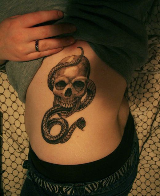 snake tattoo with skull tattoo