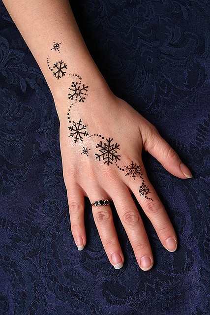 snowflake tattoo on arm