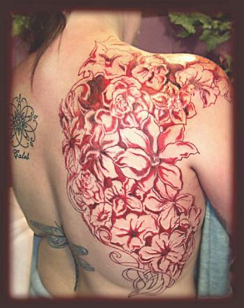 Flower Upper Back Tattoo