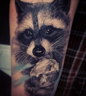 Adorable eating raccoon tattoo
