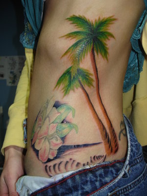 Adorable palm tree side tattoo