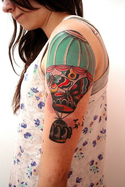 Air balloon with cage tattoo