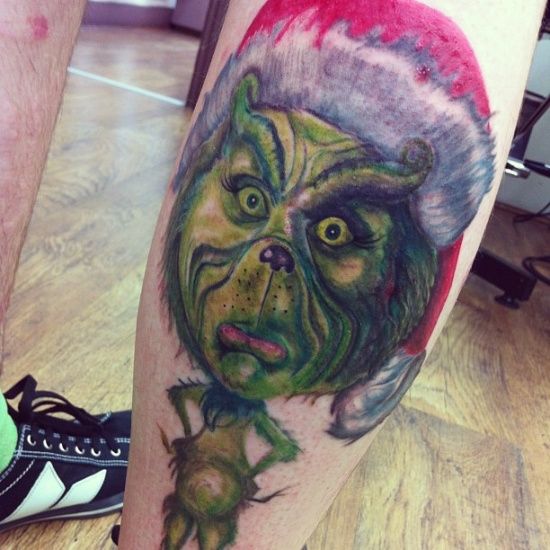 Amazing leg’s grinch christmas tattoo