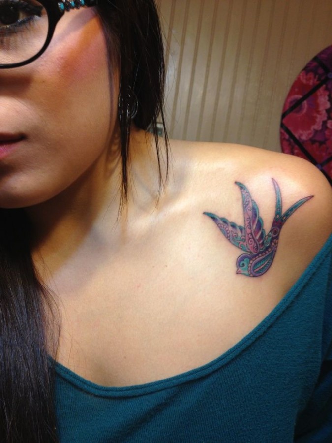 Amazing looking tribal bird tattoo