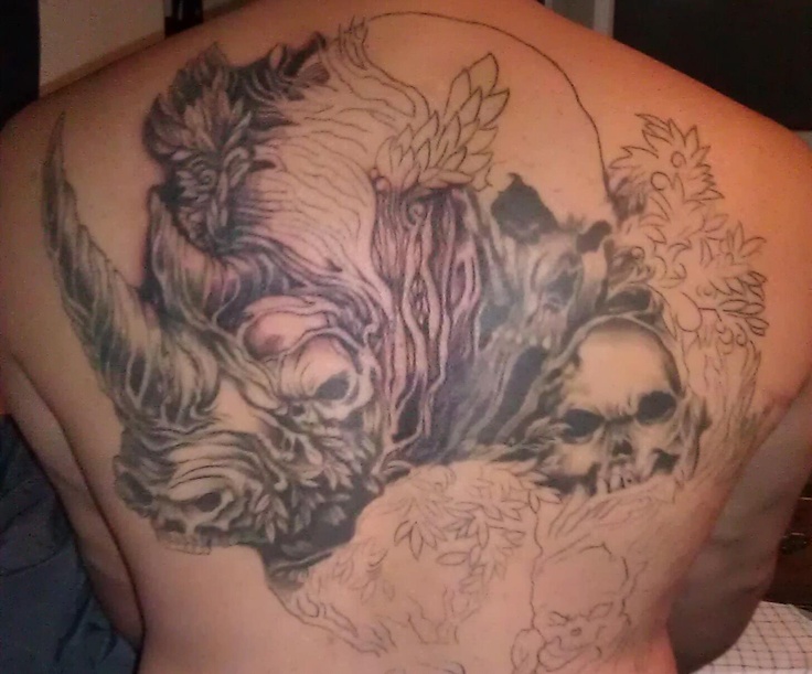 Amazing rhino and skulls back tattoo