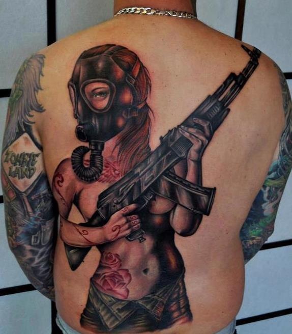 Amazing woman with gas mask back tattoo