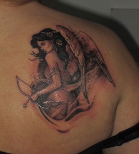 Angel with bow and arrow tattoo