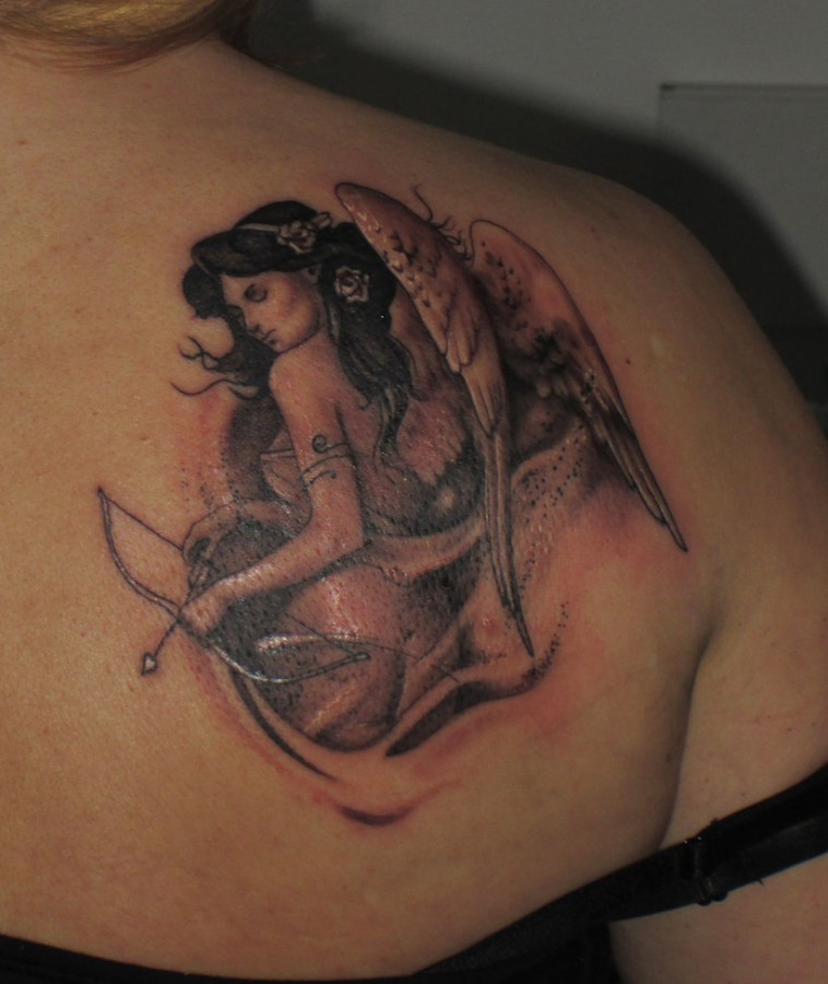 Angel with bow and arrow tattoo