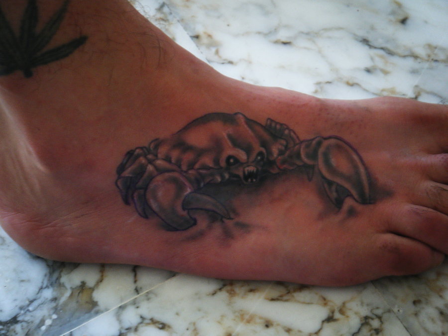 Angry crab foot tattoo