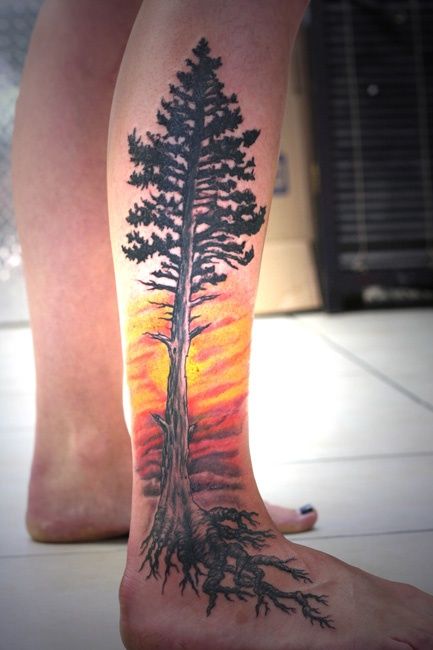 Awesome pine tree and sunset tattoo