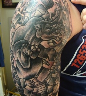Awesome rhino arm tattoo