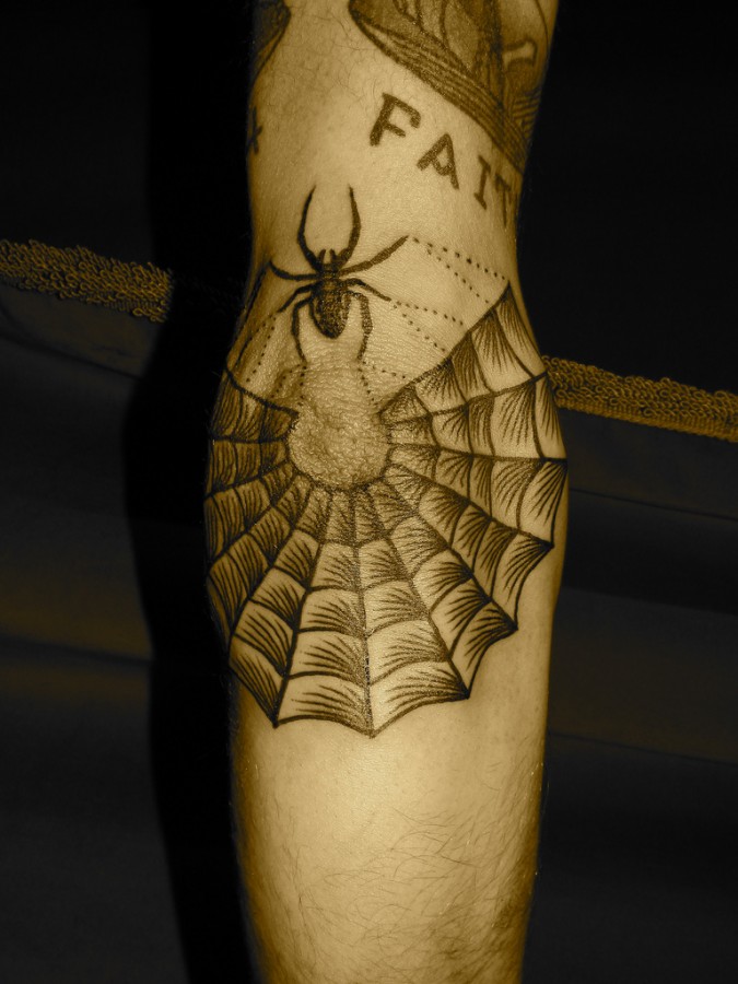 Awesome spider web arm tattoo